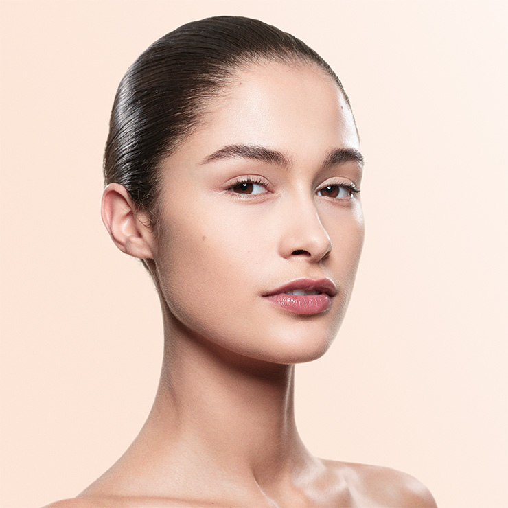 Headshot of model with product applied to face
